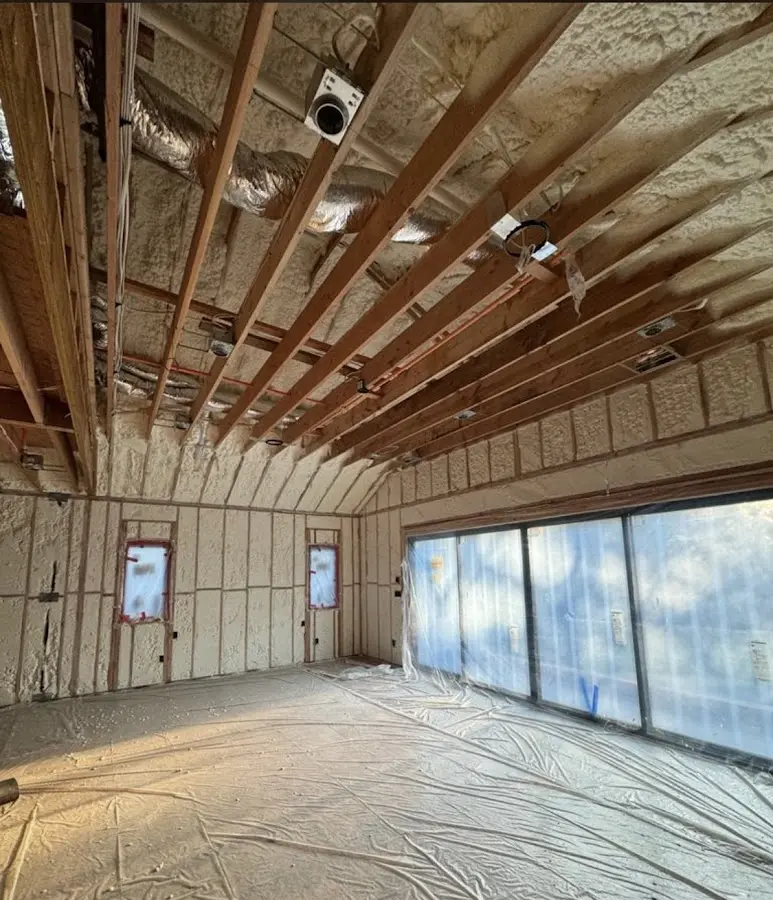 Interior walls and ceiling insulated with spray foam during new construction in Raleigh Hills